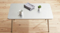 an aluminum café table that lifts away from the wall redefines flexible hospitality furniture