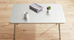 an aluminum café table that lifts away from the wall redefines flexible hospitality furniture